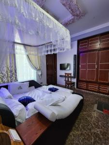Ένα ή περισσότερα κρεβάτια σε δωμάτιο στο New Janda Lodge INN