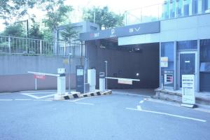 an empty parking lot in front of a building at The Comfort Triny Hotel in Yongin