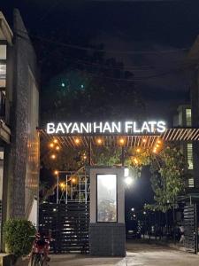 a sign on the front of a restaurant at night at Cozy 2BR Condo near Airport- Perfect for travelers in Lapu Lapu City