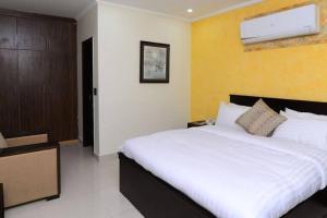 Postel nebo postele na pokoji v ubytování Hotel Signature Express