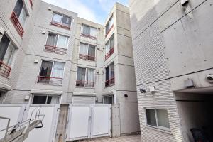 an external view of an apartment building at Shirogane Apartment in Tokyo