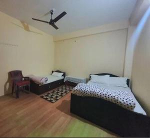 Postel nebo postele na pokoji v ubytování Hotel Deeps Home
