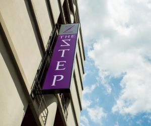 a purple sign on the side of a building at Collection O The Step Sathorn in Bangkok