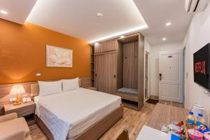 Postel nebo postele na pokoji v ubytování Moon Hotel 2 Đỗ Quang