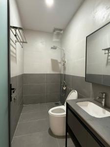 a bathroom with a toilet and a sink at homestay halona in Phu Quoc +277 photos