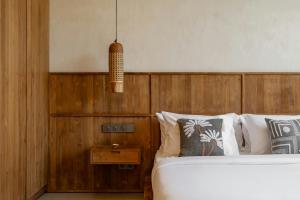 En eller flere senge i et værelse på Villa Monoï Uluwatu
