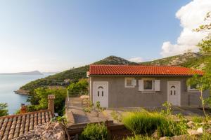 a house with a view of the water at Starigrad Apartment in Starigrad