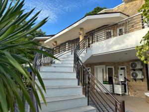 a set of stairs leading up to a building at Castle View Hotel Samal in Magamomo