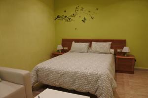 Postel nebo postele na pokoji v ubytování Hostal Andrés