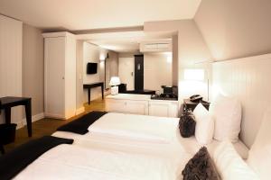 Cama ou camas em um quarto em Hotel Victoria