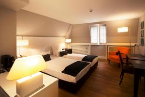 Cama ou camas em um quarto em Hotel Victoria