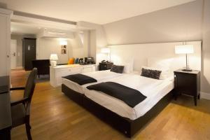 Cama ou camas em um quarto em Hotel Victoria