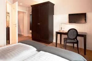 Cama ou camas em um quarto em Hotel Victoria