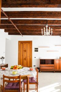 a dining room with a table with fruit on it at Cà Marin in Venice