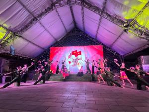 a group of people dancing on a stage at Khu du lịch sinh thái Him Lam - Him Lam Resort in Ban Hin Lom +92 photos