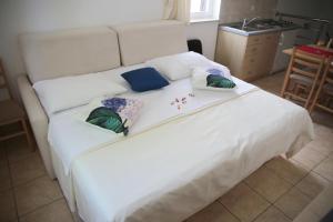 Posteľ alebo postele v izbe v ubytovaní Apartments Tamarix