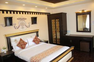 Kama o mga kama sa kuwarto sa Hotel Encounter Nepal & Spa