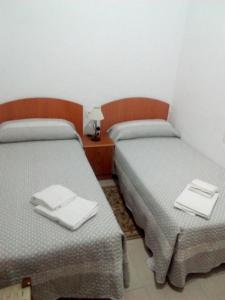 Postel nebo postele na pokoji v ubytování Hostal Batato