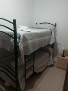 Postel nebo postele na pokoji v ubytování Hostal Batato