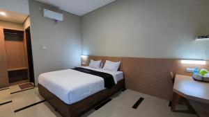 Postel nebo postele na pokoji v ubytování Beringin View Hotel & Resort