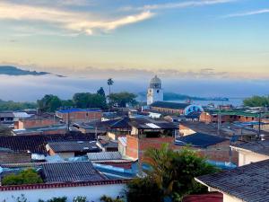 a view of a town with a clock tower at Hotel San Vicente in Darién