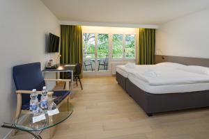 Voodi või voodid majutusasutuse VitalBoutique Hotel Zurzacherhof toas