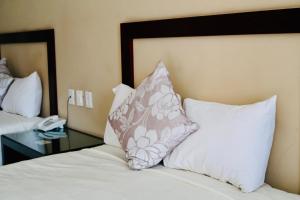 Uma cama ou camas num quarto em Hotel Yorio Inn