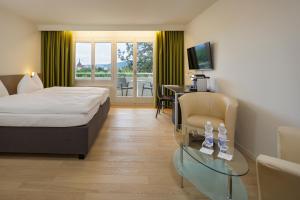 Voodi või voodid majutusasutuse VitalBoutique Hotel Zurzacherhof toas