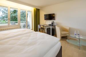 Voodi või voodid majutusasutuse VitalBoutique Hotel Zurzacherhof toas
