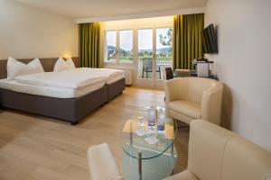 Voodi või voodid majutusasutuse VitalBoutique Hotel Zurzacherhof toas