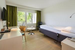 Televiisor ja/või meelelahutuskeskus majutusasutuses VitalBoutique Hotel Zurzacherhof