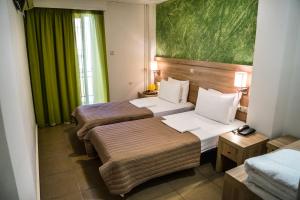 Postel nebo postele na pokoji v ubytování Anita Hotel