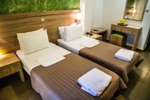 Postel nebo postele na pokoji v ubytování Anita Hotel