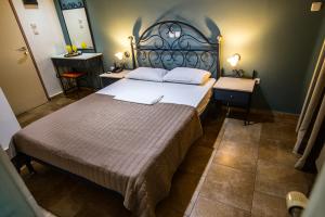 Postel nebo postele na pokoji v ubytování Anita Hotel