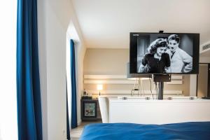 TV a/nebo společenská místnost v ubytování Hotel Novum