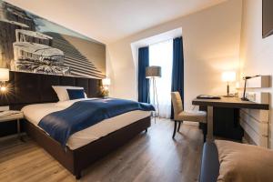 Postel nebo postele na pokoji v ubytování Hotel Novum