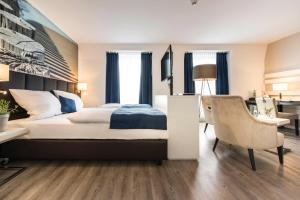 Postel nebo postele na pokoji v ubytování Hotel Novum
