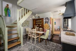 a dining room and kitchen with a table and chairs at Siliguri Traditional House in Rhodes Town +23 photos