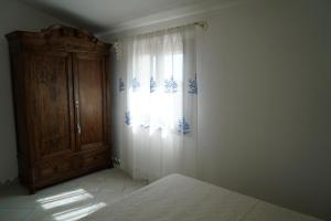 A bed or beds in a room at Villa da Luciana