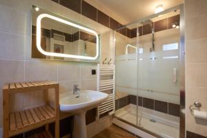 a bathroom with a sink and a shower at Chalet Aventure B&B Les Gets in Les Gets +66 photos