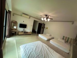 Łóżko lub łóżka w pokoju w obiekcie Cian Yuan B&B