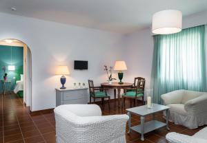 A television and/or entertainment centre at Keri Village & Spa by Zante Plaza (Adults Only)