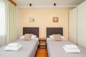 Postel nebo postele na pokoji v ubytování Boutique rooms Kican