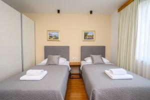 Postel nebo postele na pokoji v ubytování Boutique rooms Kican