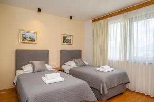 Postel nebo postele na pokoji v ubytování Boutique rooms Kican