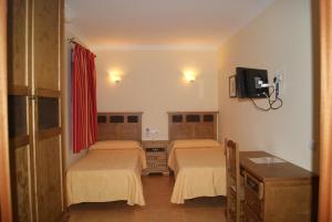 מיטה או מיטות בחדר ב-Hotel Restaurante Berlanga
