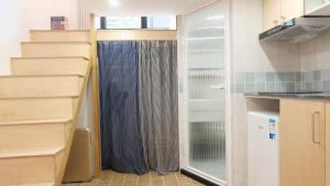 a kitchen with a shower curtain in a kitchen at FFC sweet home on Shaanxi Road in Shanghai