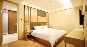 Postel nebo postele na pokoji v ubytování JI Hotel Shanghai Zhangjiang