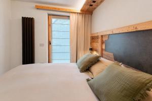 Postel nebo postele na pokoji v ubytování Chalet Adelina