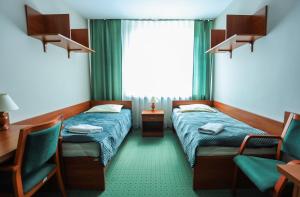 Posteľ alebo postele v izbe v ubytovaní Hotel Krakowiak